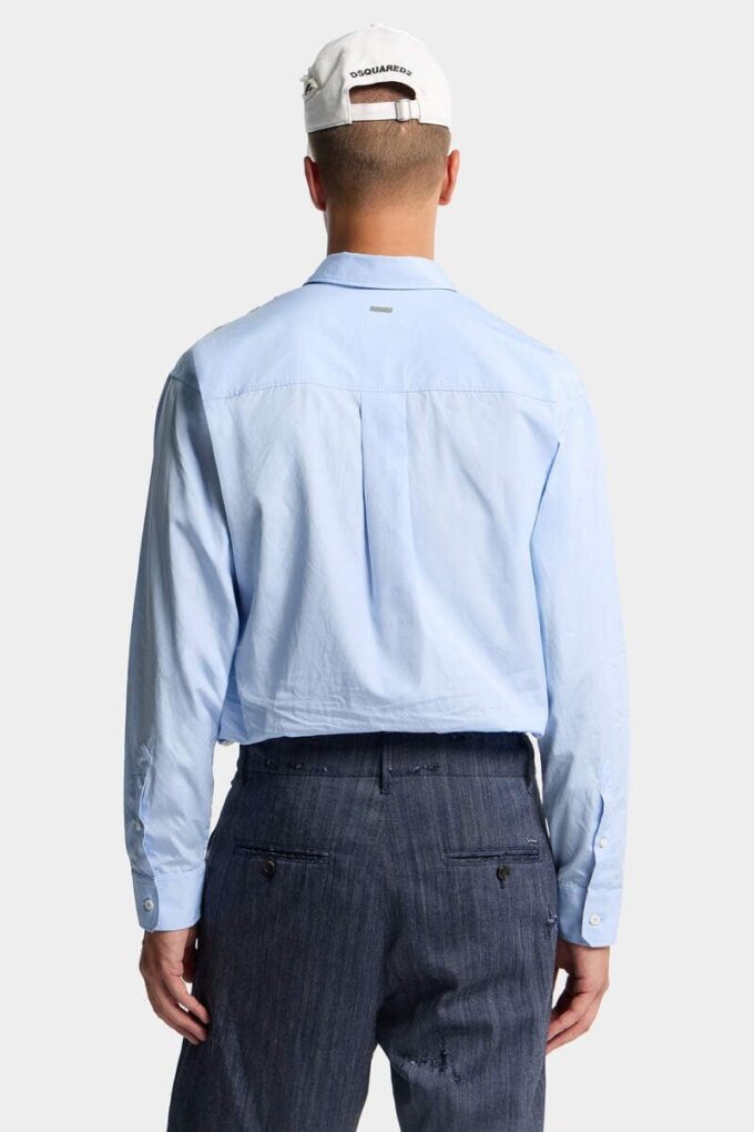 Camisa de hombros caídos con corte sin rematar