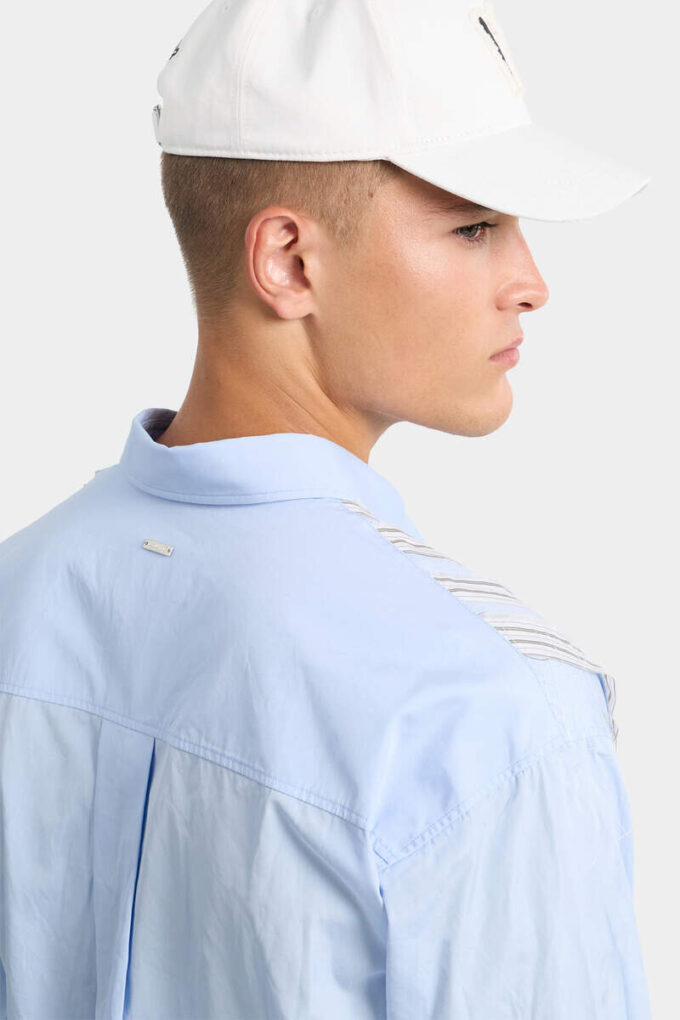 Camisa de hombros caídos con corte sin rematar