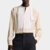 Camisa de seda con pajarita y hombros caídos Camisa de seda con pajarita y hombros caídos